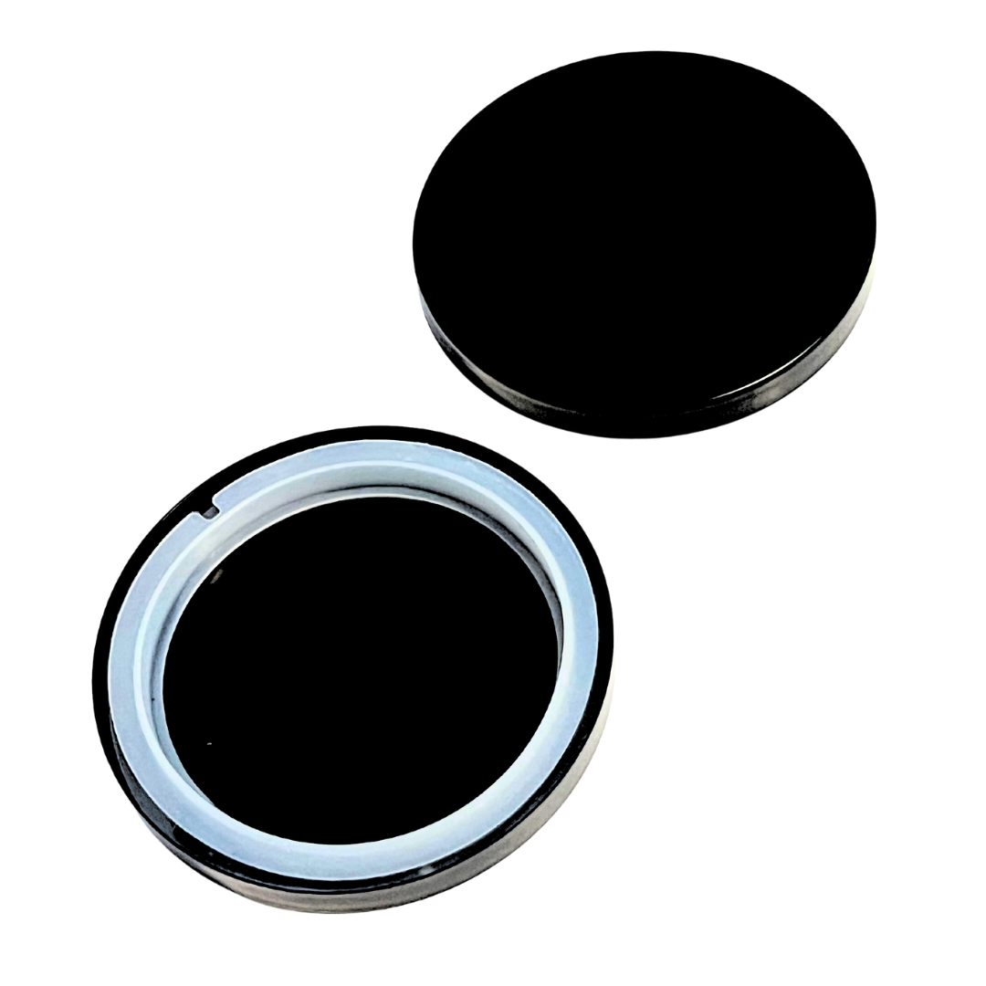 Glossy black round cosmetic jar with white inner seal, ideal for skincare, balm, or candle storage